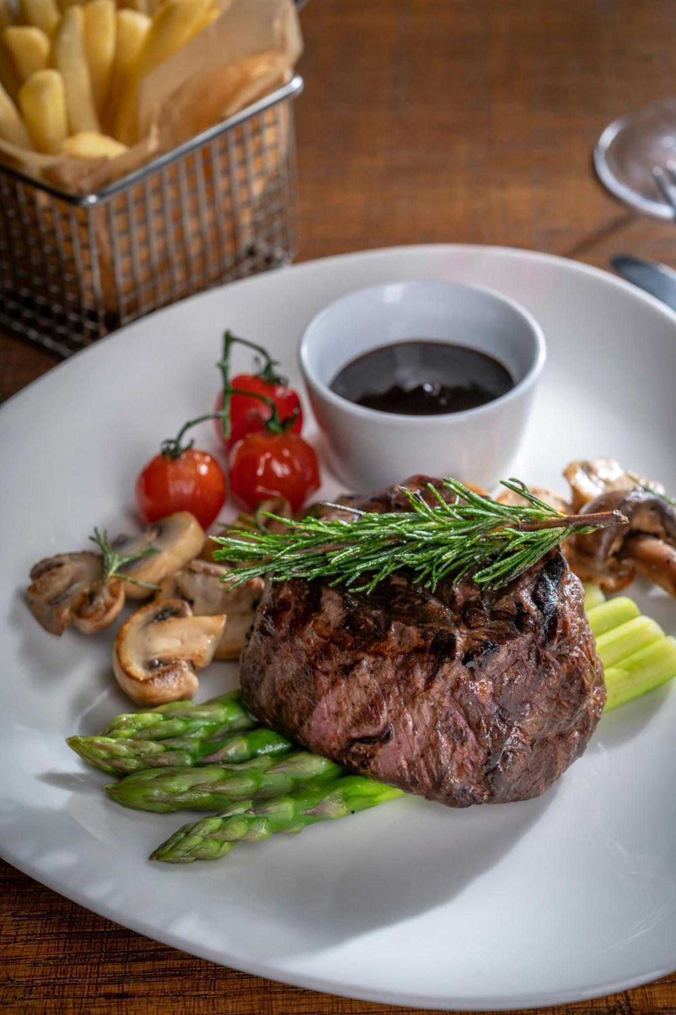 Marriott Hotel Al Jaddaf, Dubai Exterior photo A steak prepared with a sprig of tarragon